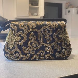 Small handbag with built in compact mirror